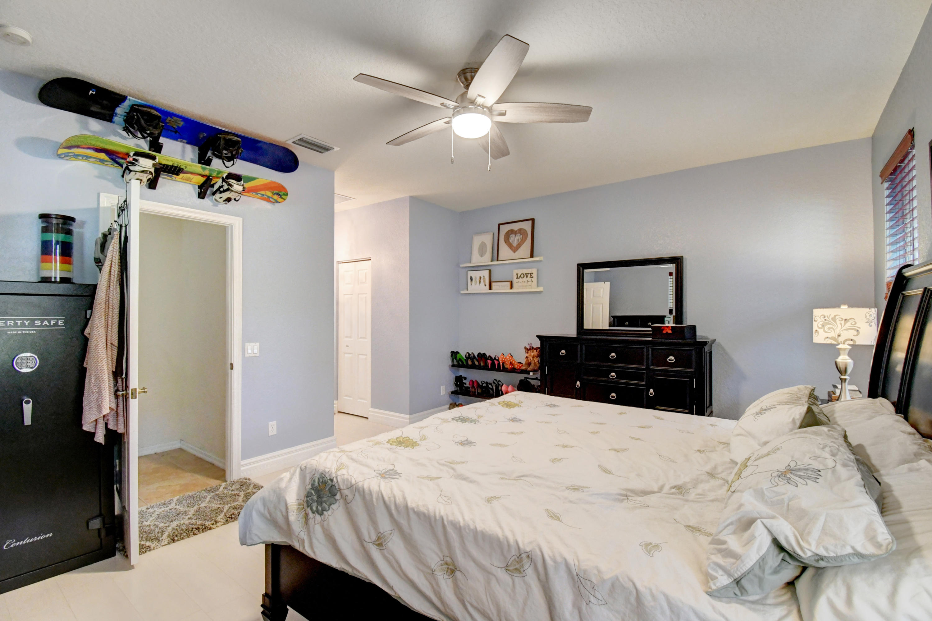 804 Quartz Terrace West Palm Beach, FL 33413 - Photo 27 of 65 a bed room with a bed and a chandelier