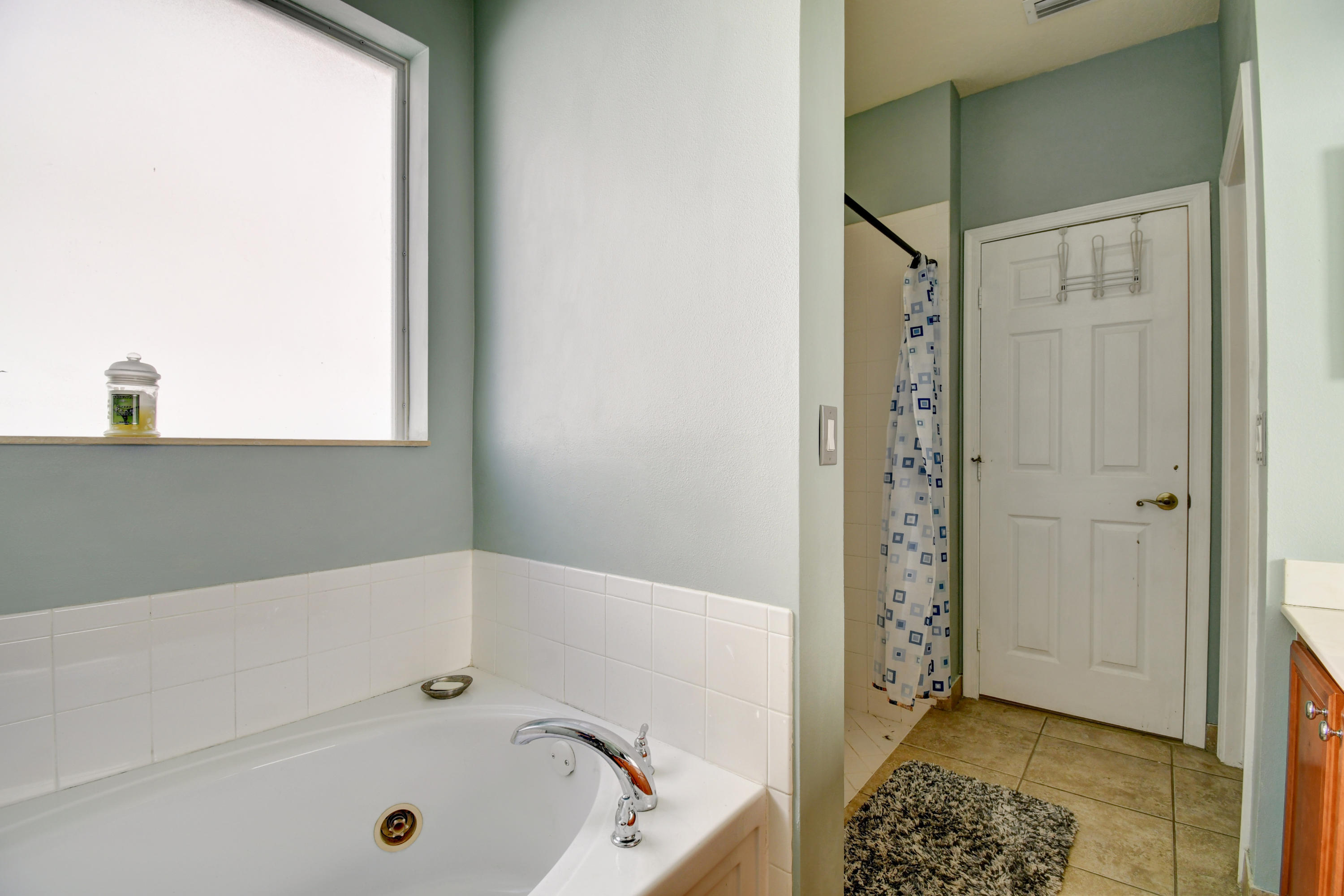 804 Quartz Terrace West Palm Beach, FL 33413 - Photo 30 of 65 a bathroom with a bathtub and a shower