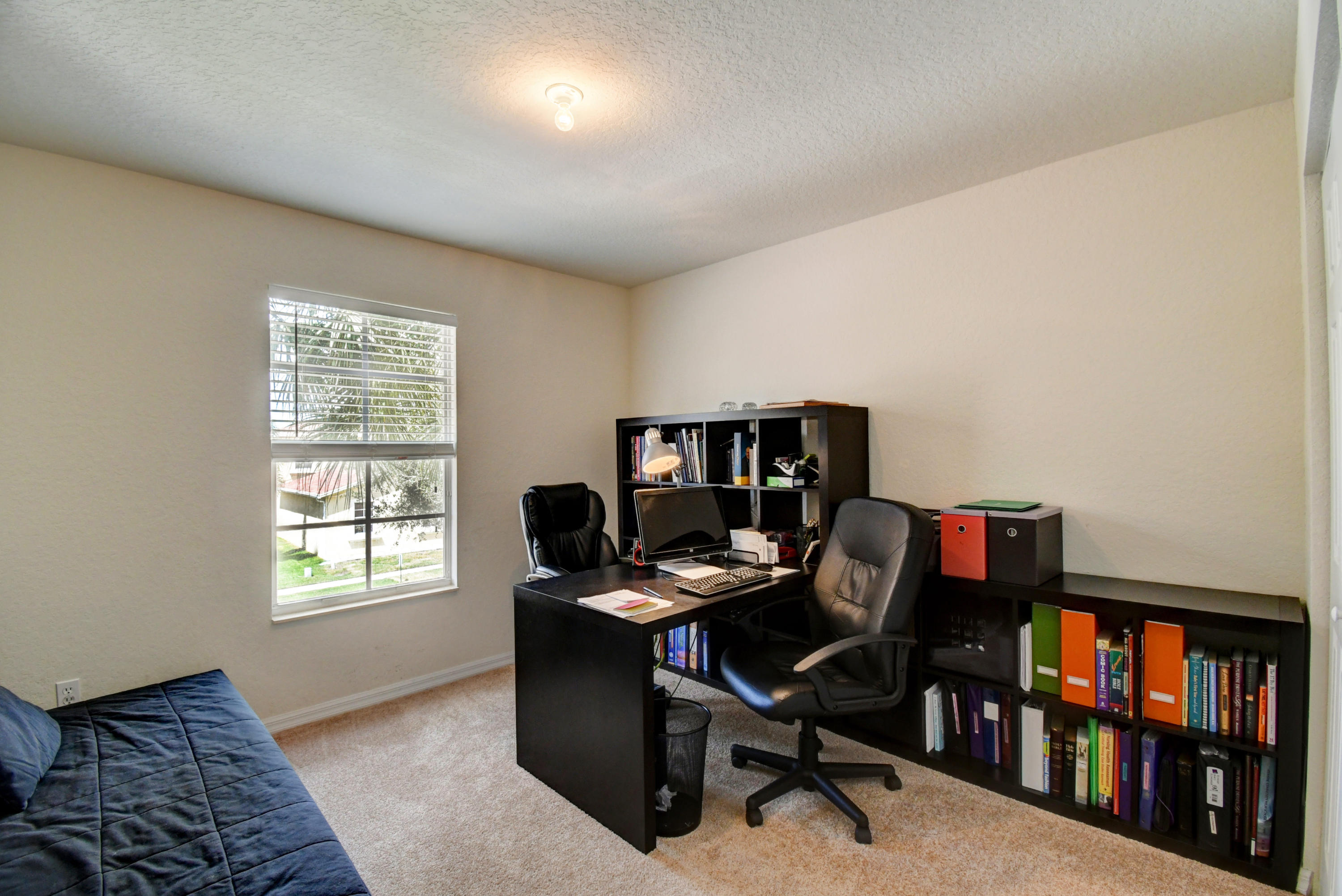 804 Quartz Terrace West Palm Beach, FL 33413 - Photo 39 of 65 a view of a workspace with furniture and a window