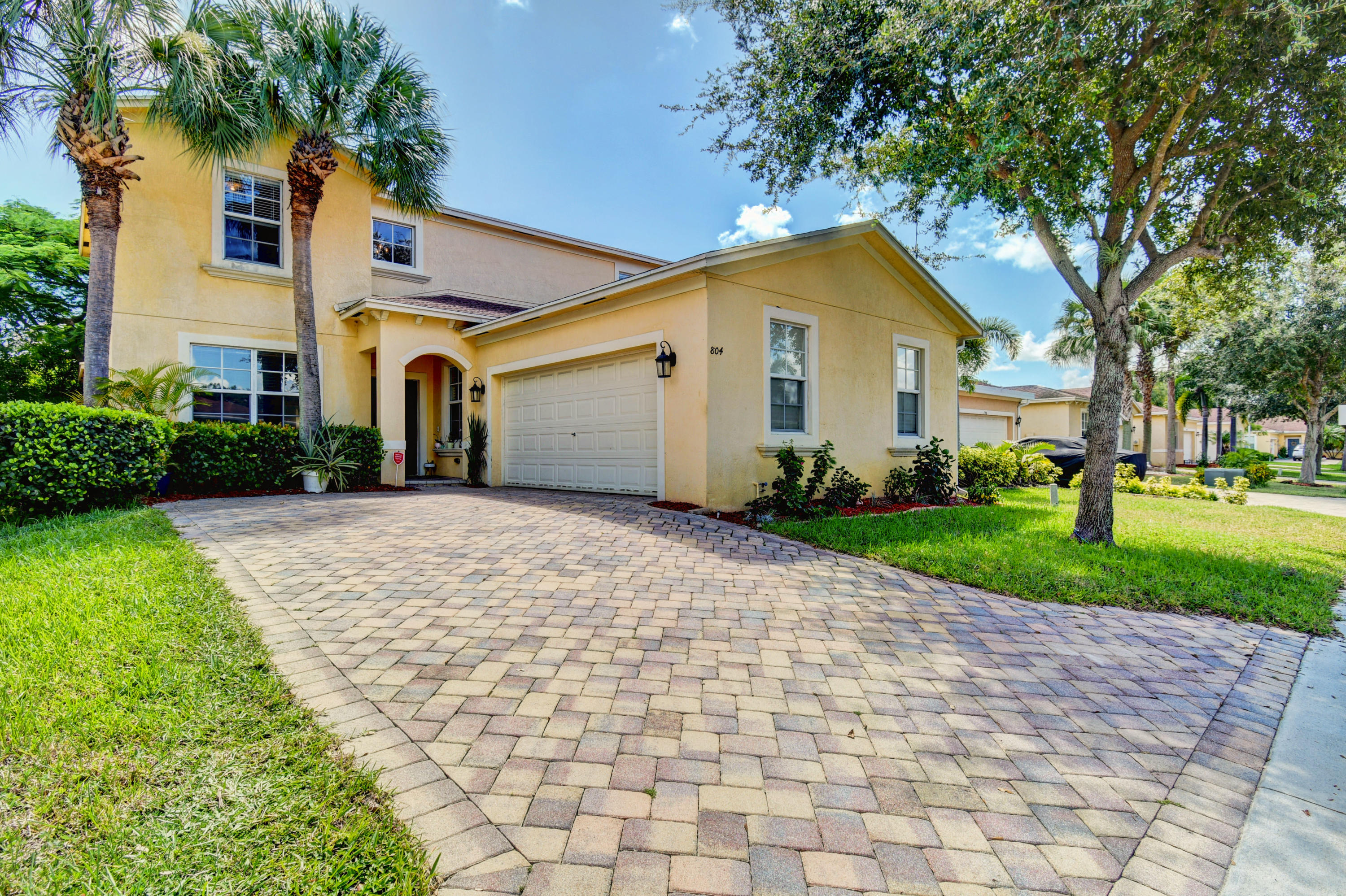 804 Quartz Terrace West Palm Beach, FL 33413 - Photo 4 of 65 a front view of a house with a yard and trees