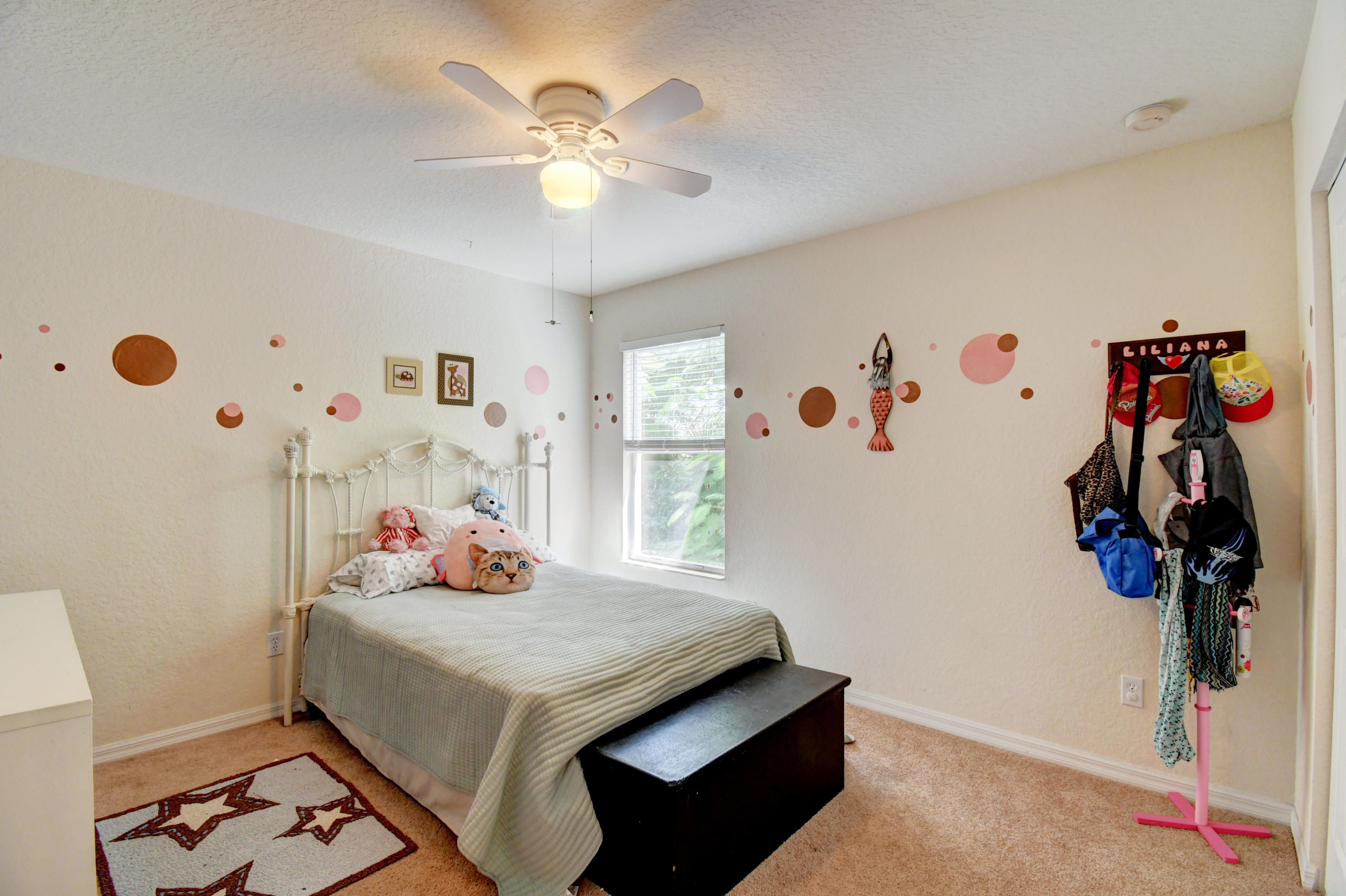 804 Quartz Terrace West Palm Beach, FL 33413 - Photo 43 of 65 a bedroom with a bed and a chandelier