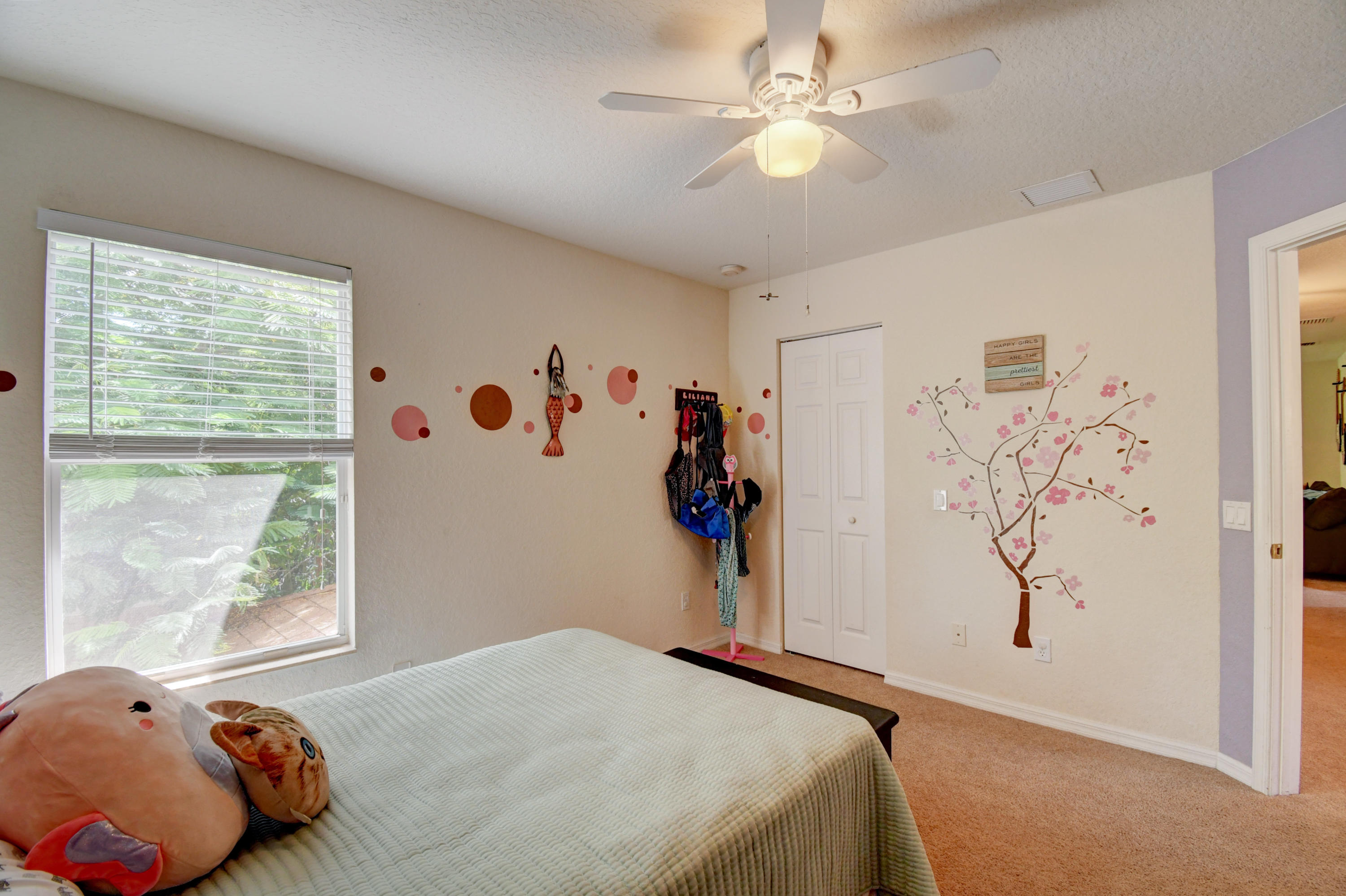 804 Quartz Terrace West Palm Beach, FL 33413 - Photo 44 of 65 a bedroom with a bed and a window