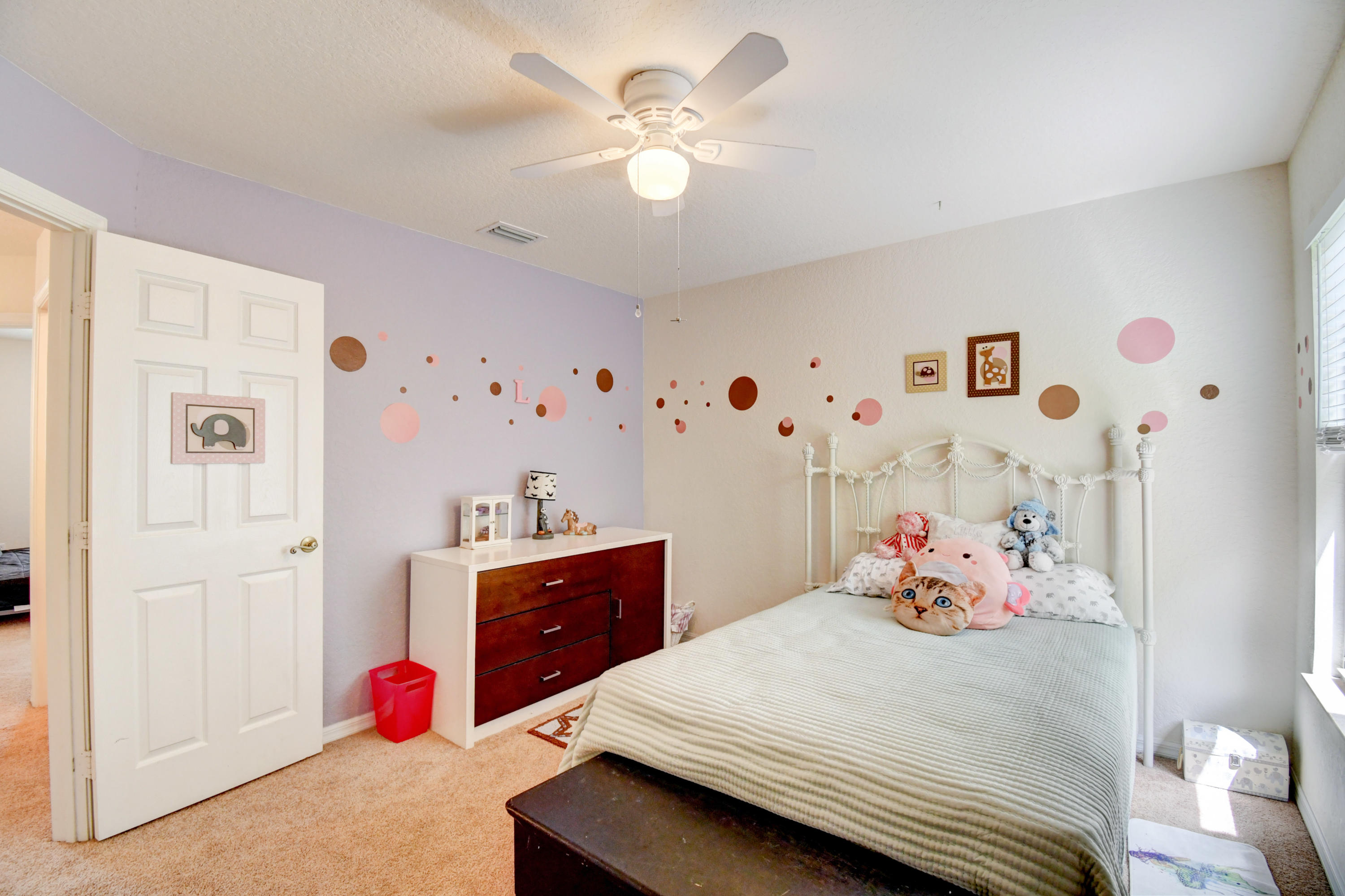 804 Quartz Terrace West Palm Beach, FL 33413 - Photo 45 of 65 a bedroom with a bed and a chandelier