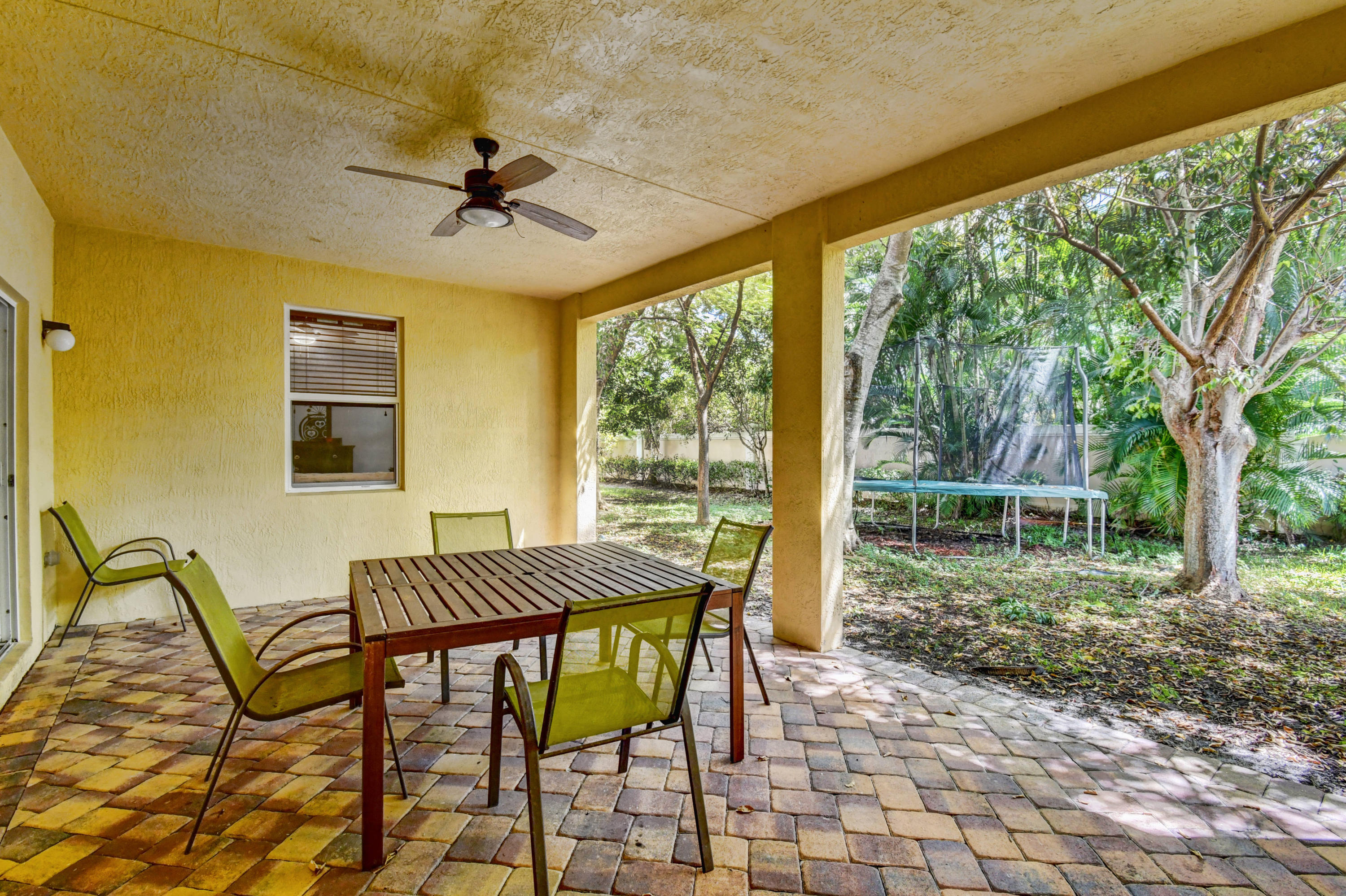 804 Quartz Terrace West Palm Beach, FL 33413 - Photo 48 of 65 a view of a patio with a backyard