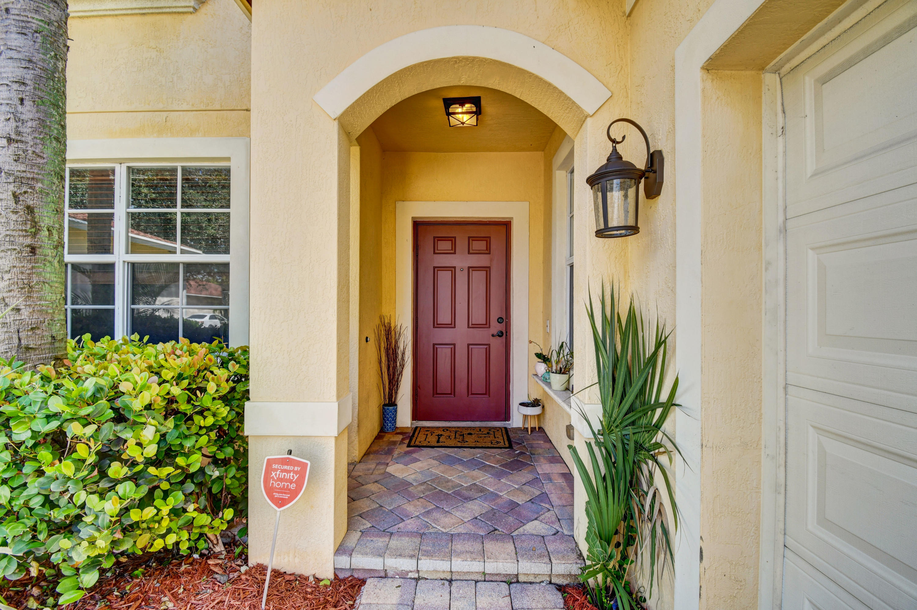 804 Quartz Terrace West Palm Beach, FL 33413 - Photo 8 of 65 a couple of potted plants in front of a door