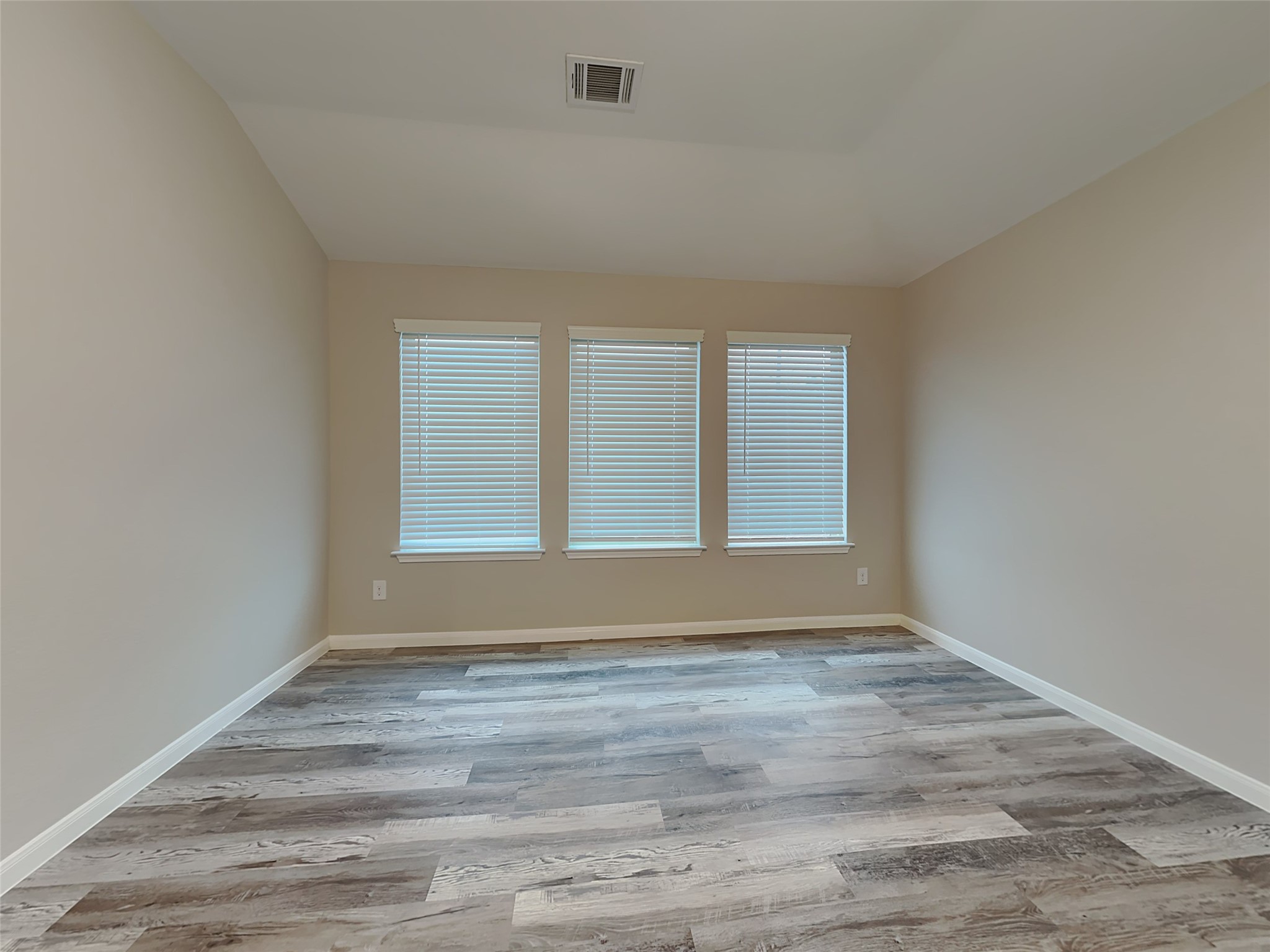 227 Murrieta Lane Rosharon, TX 77583 - Photo 15 of 16 a view of an empty room with wooden floor and a window