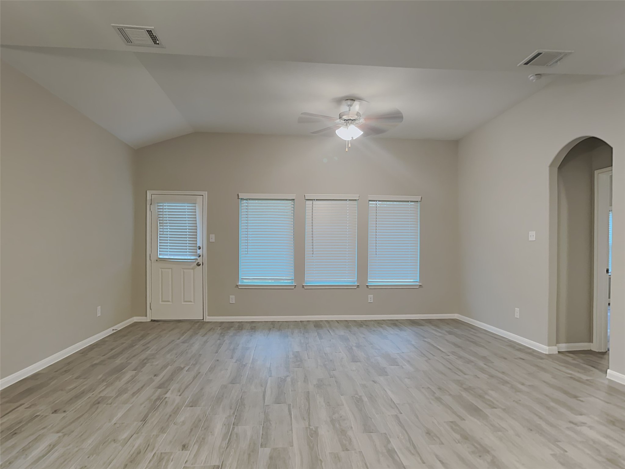 227 Murrieta Lane Rosharon, TX 77583 - Photo 2 of 16 wooden floor in an empty room with a window