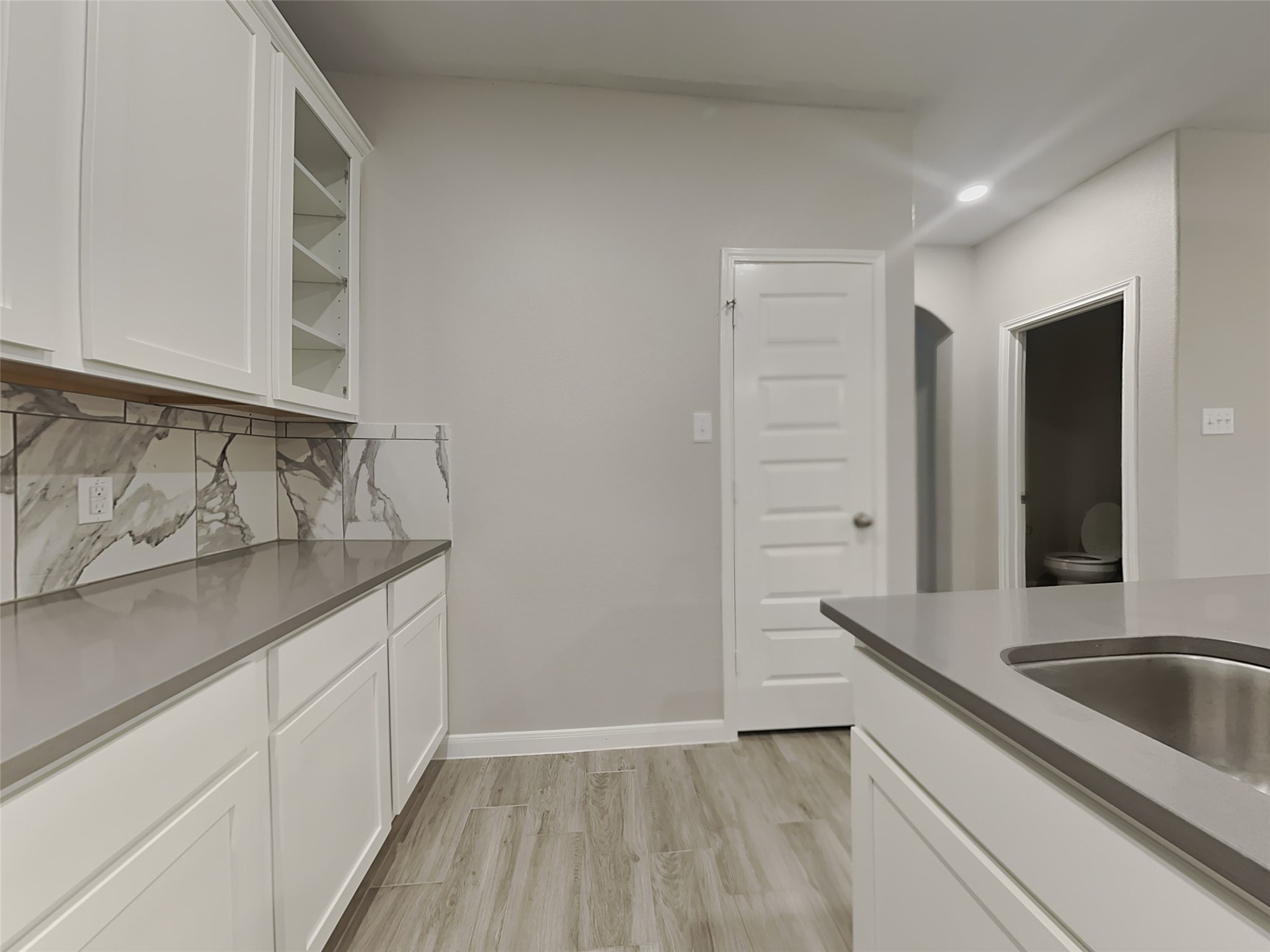 227 Murrieta Lane Rosharon, TX 77583 - Photo 6 of 16 a kitchen with a sink and cabinets