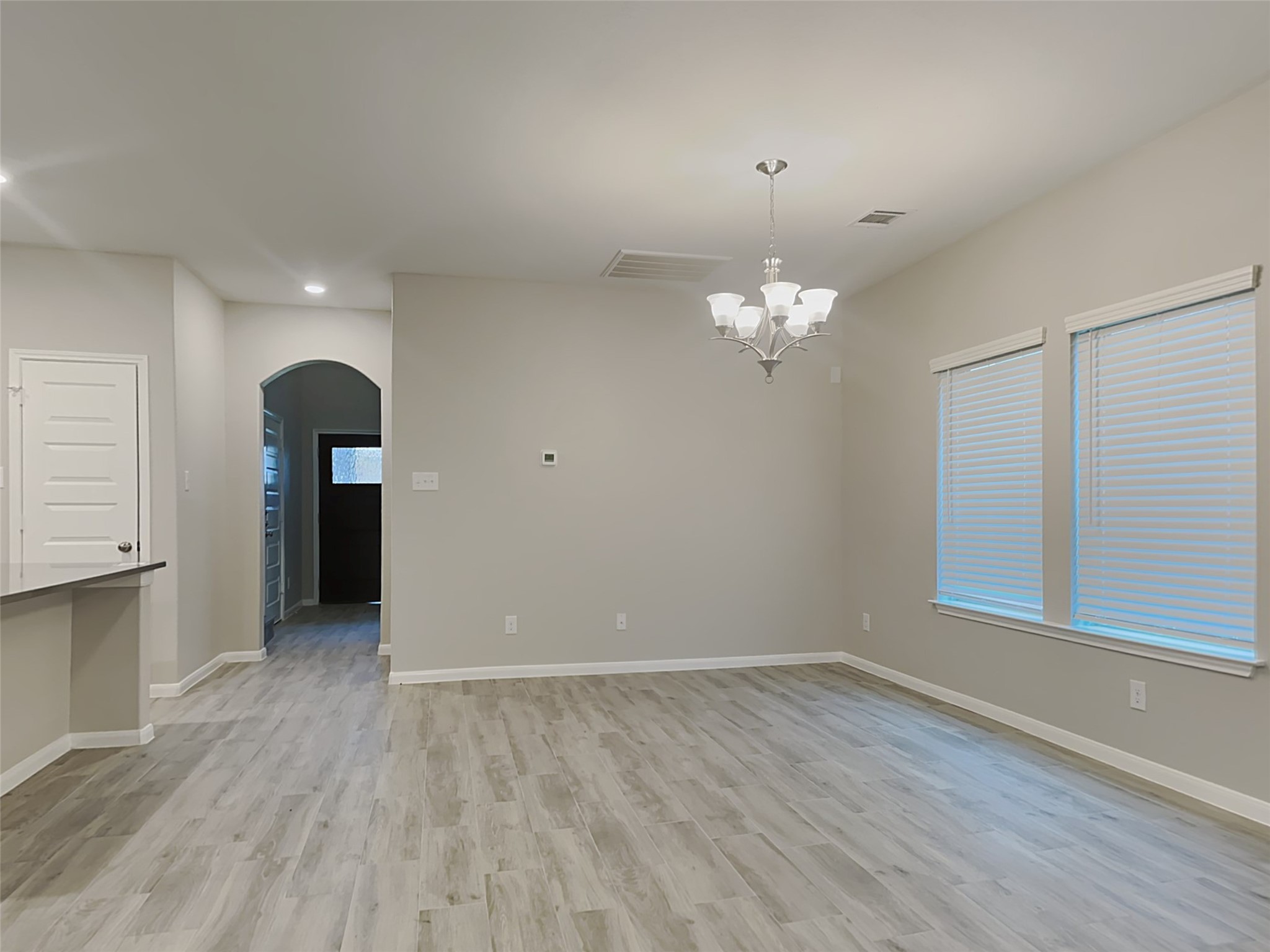 227 Murrieta Lane Rosharon, TX 77583 - Photo 7 of 16 wooden floor in an empty room with a window