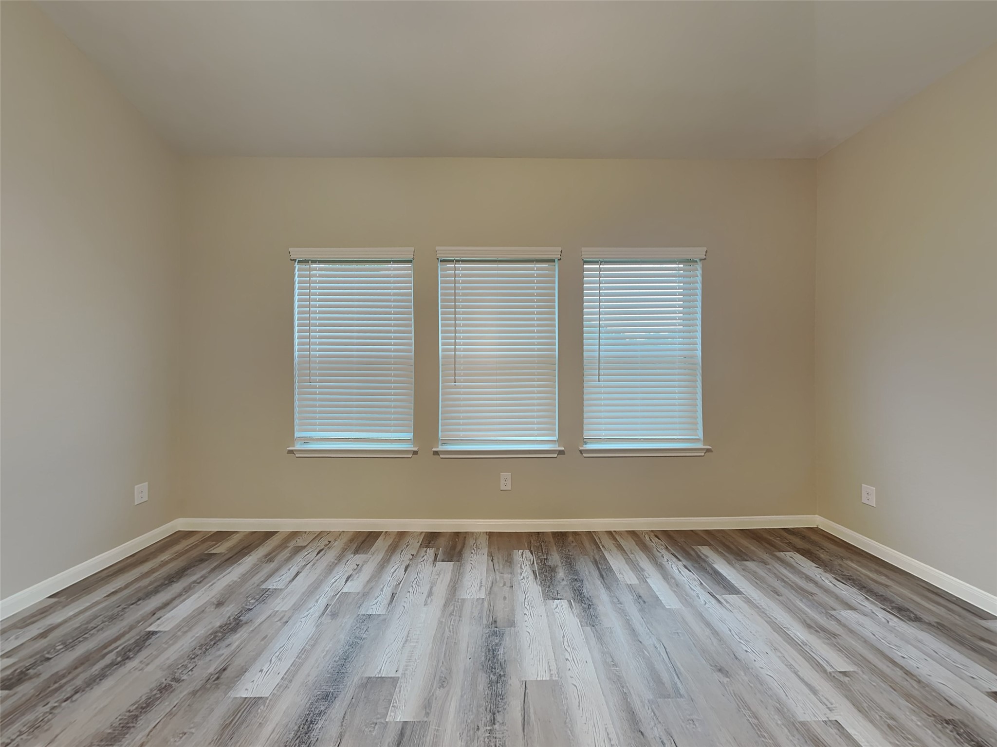 227 Murrieta Lane Rosharon, TX 77583 - Photo 8 of 16 a view of an empty room with wooden floor and a window