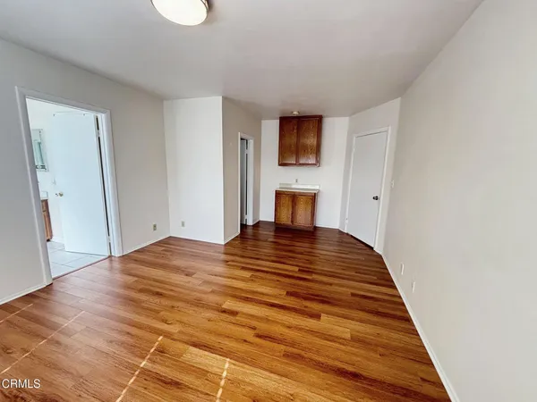 a bedroom with a bed and a television