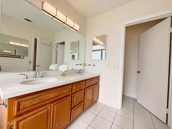 a bathroom with a sink a vanity and a mirror