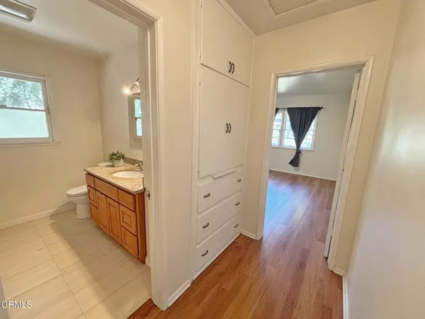 a bathroom with a sink a mirror and a toilet