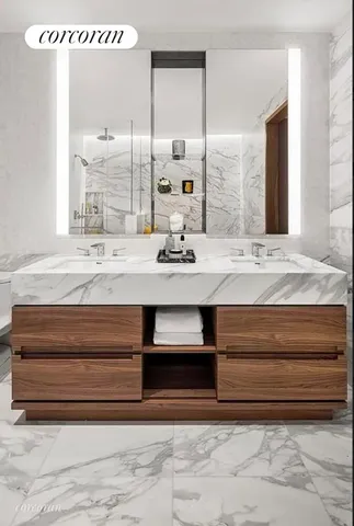 a bedroom with a bed couch and window