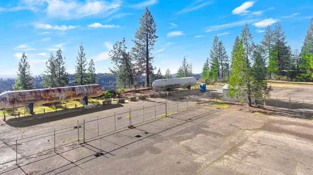 a view of a terrace with chairs and fire pit