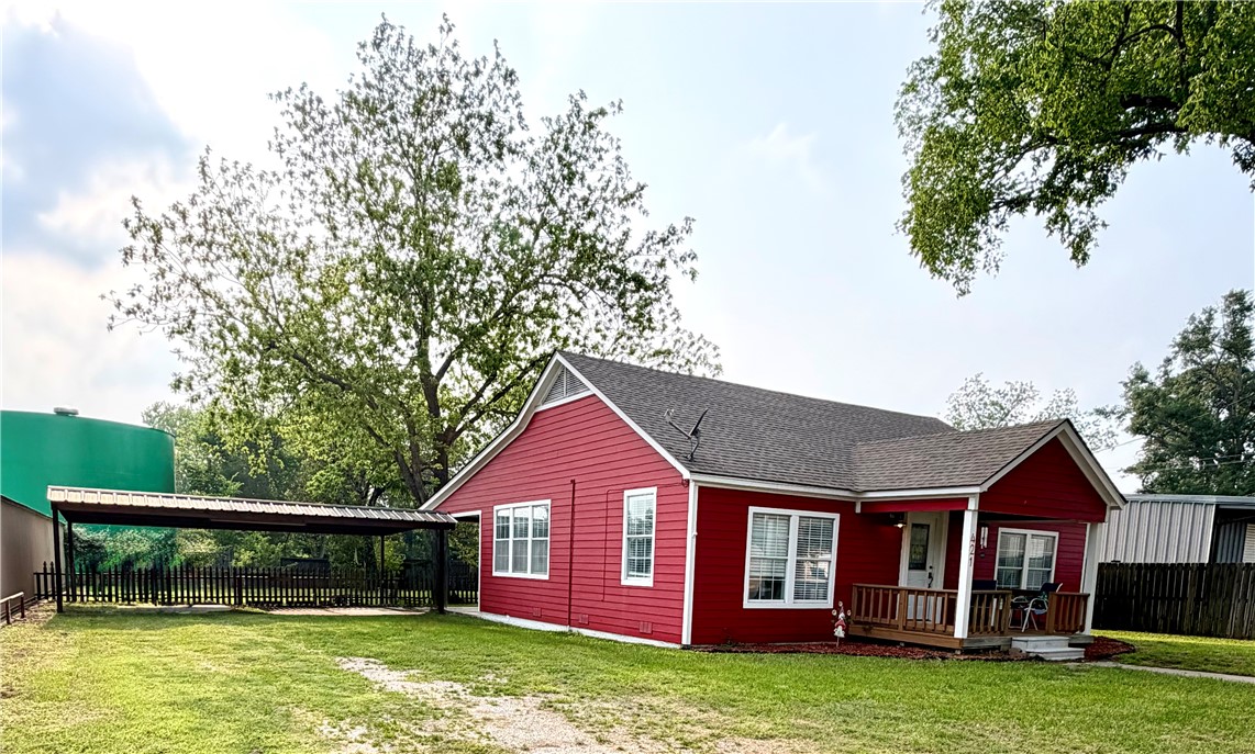 421 South Commerce Street Centerville, TX 75833 - Photo 6 of 23 a view of a house with a swimming pool