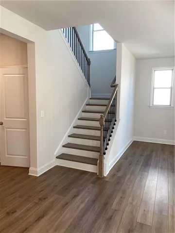 a view of entryway with wooden floor