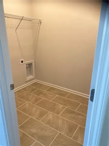 a bathroom with a white toilet and shower