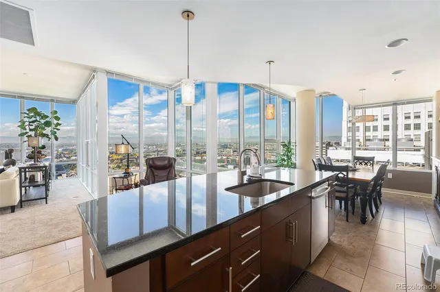 a very nice looking dining room with a large window