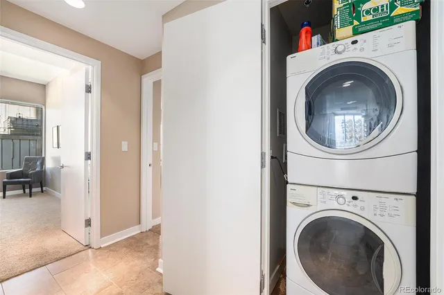 a view of a hallway with washer and dryer