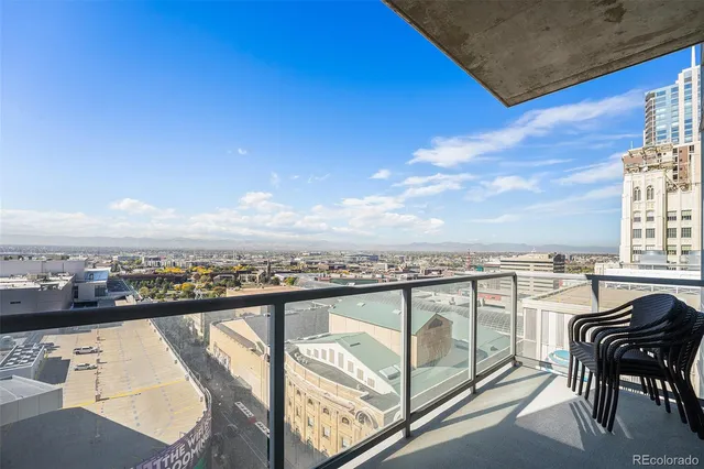 a view of a balcony with furniture