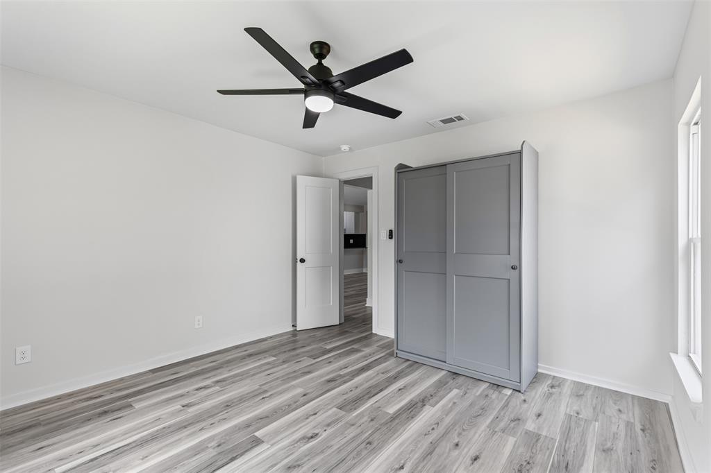 2327 Brookfield Avenue Dallas, TX 75235 - Photo 15 of 31 wooden floor in an empty room