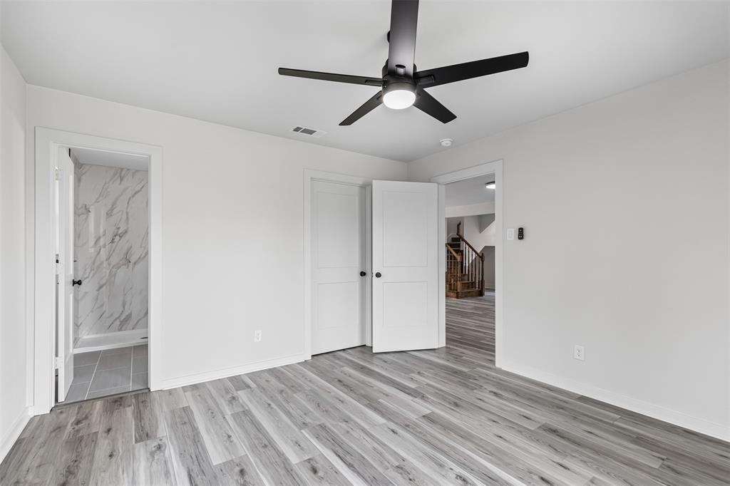 2327 Brookfield Avenue Dallas, TX 75235 - Photo 19 of 31 a view of empty room with wooden floor