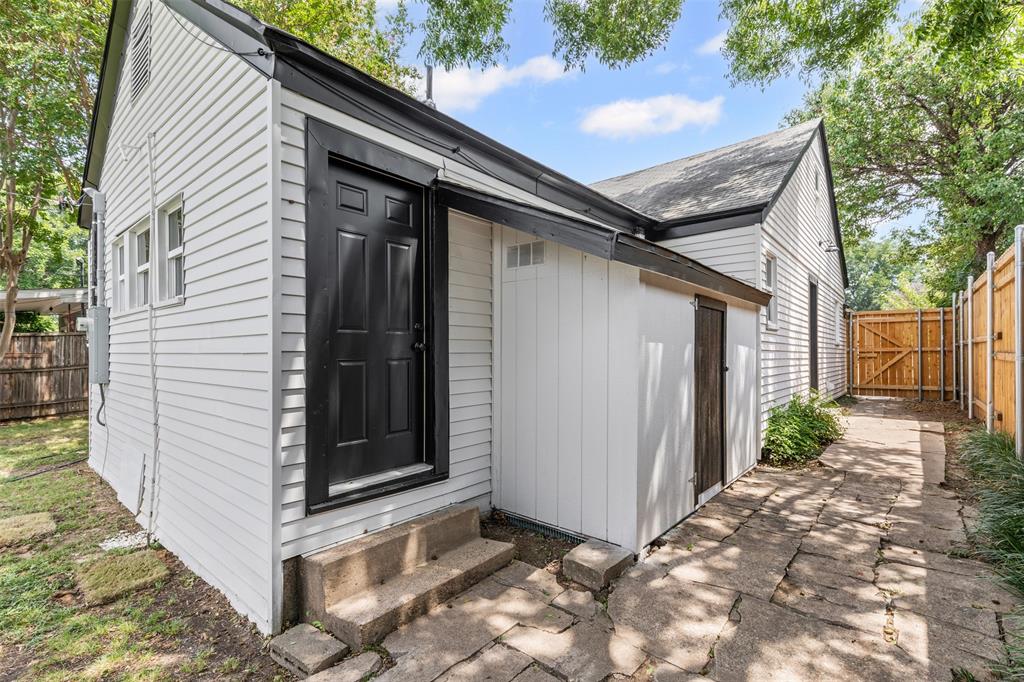 2327 Brookfield Avenue Dallas, TX 75235 - Photo 24 of 31 a view of house with backyard and trees