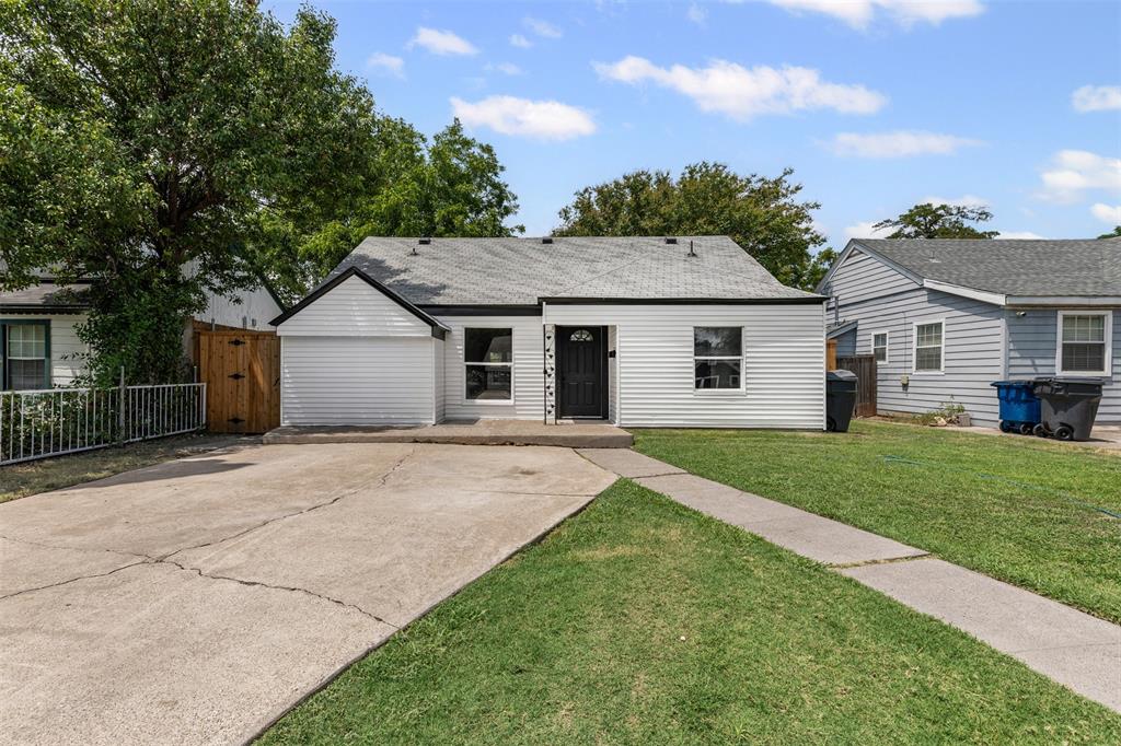 2327 Brookfield Avenue Dallas, TX 75235 - Photo 25 of 31 a view of a yard in front of a house with plants and large tree