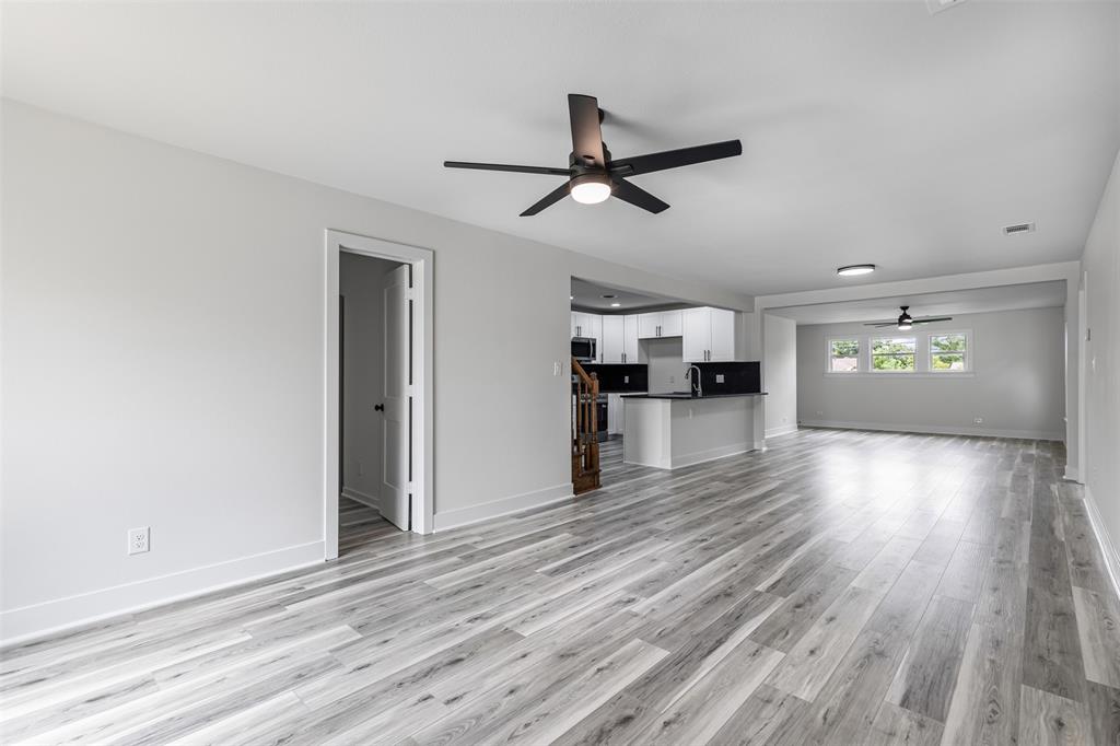 2327 Brookfield Avenue Dallas, TX 75235 - Photo 6 of 31 a view of empty room with wooden floor