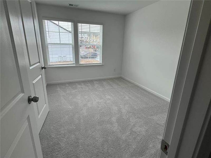100 Mission Boulevard Pendergrass, GA 30567 - Photo 9 of 17 an empty room with a window