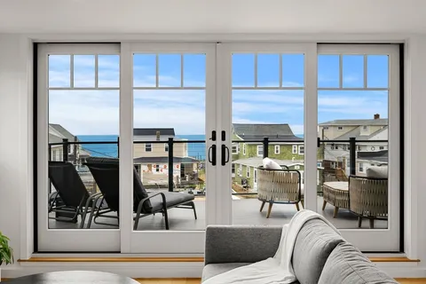 a view of a living room couch and a window