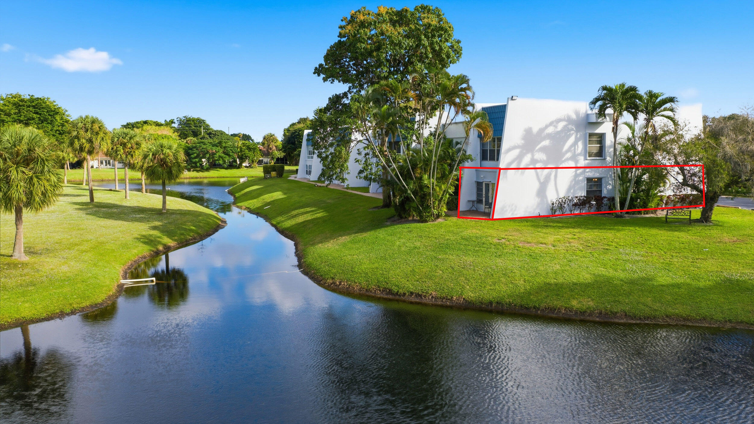 a view of a lake with a building in the background
