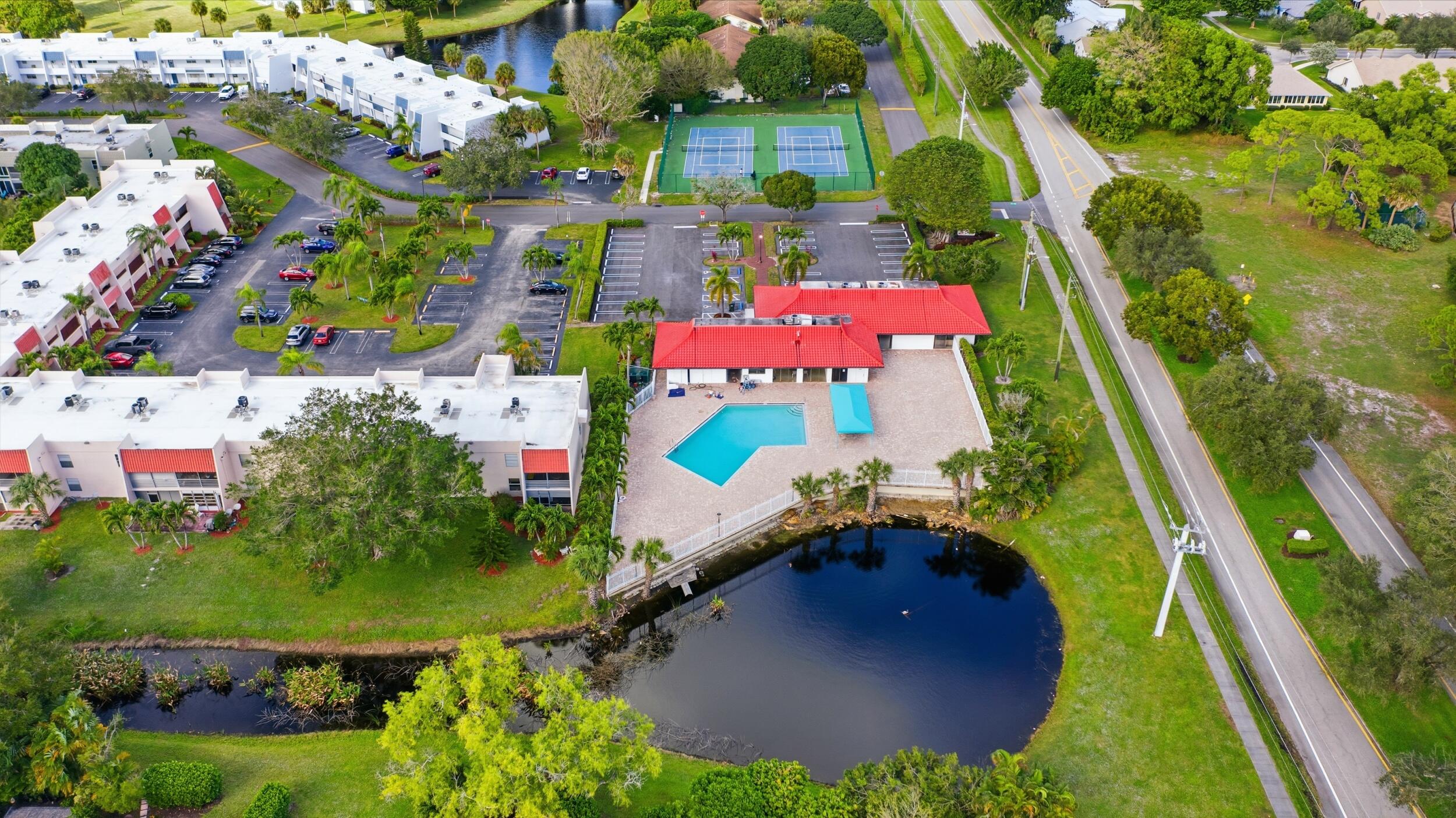 2600 Fiore Way, Unit 101C Delray Beach, FL 33445 - Photo 30 of 40 an aerial view of residential house with outdoor space and swimming pool