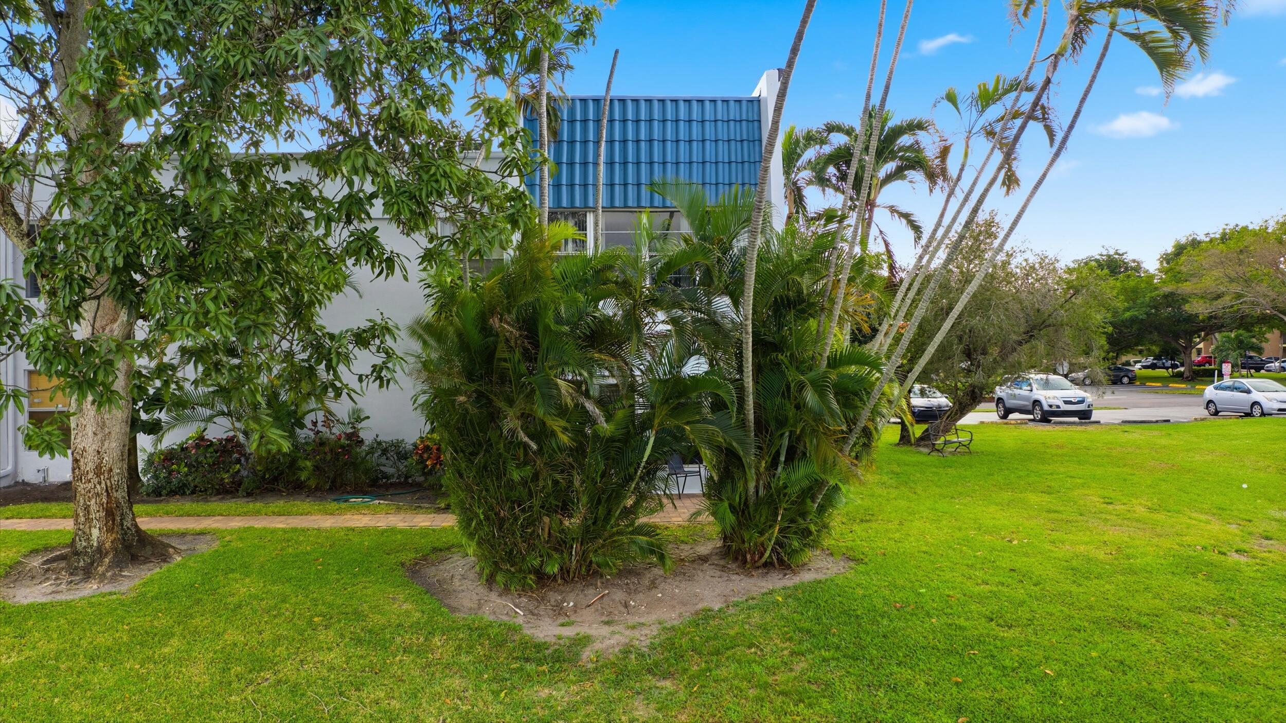 2600 Fiore Way, Unit 101C Delray Beach, FL 33445 - Photo 35 of 40 a view of a garden