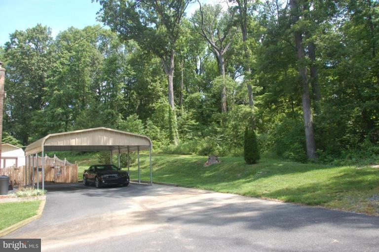 8902 Philadelphia Road Baltimore, MD 21237 - Photo 13 of 25 Carport backs to woods
