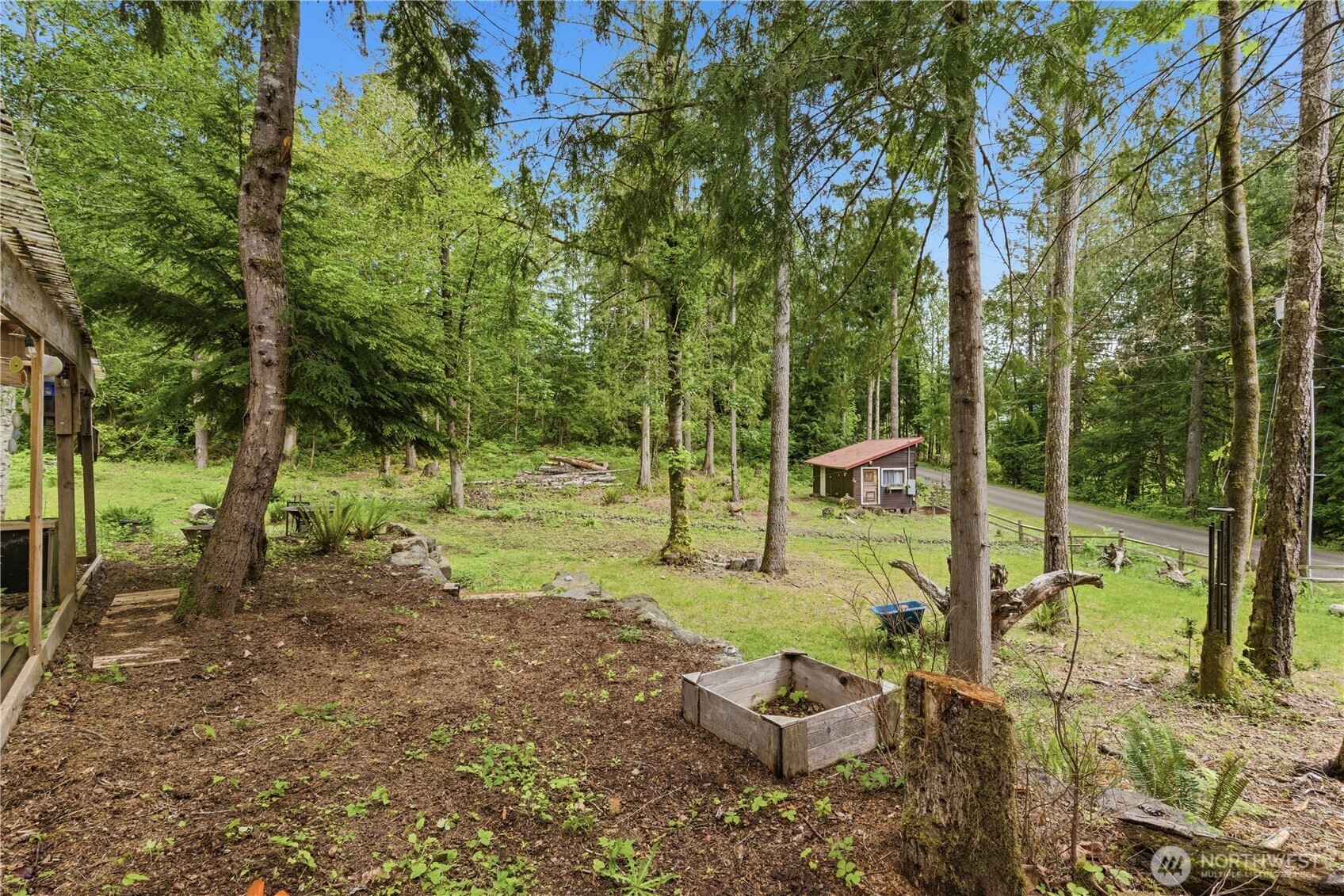 3320 Duckabush Road Brinnon, WA 98320 - Photo 34 of 38 a view of a backyard with plants and patio