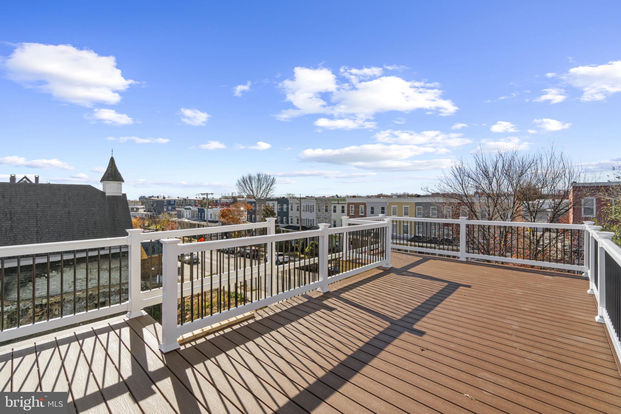 3461 Keswick Road Baltimore, MD 21211 - Photo 11 of 33 a view of balcony with deck and wooden floor