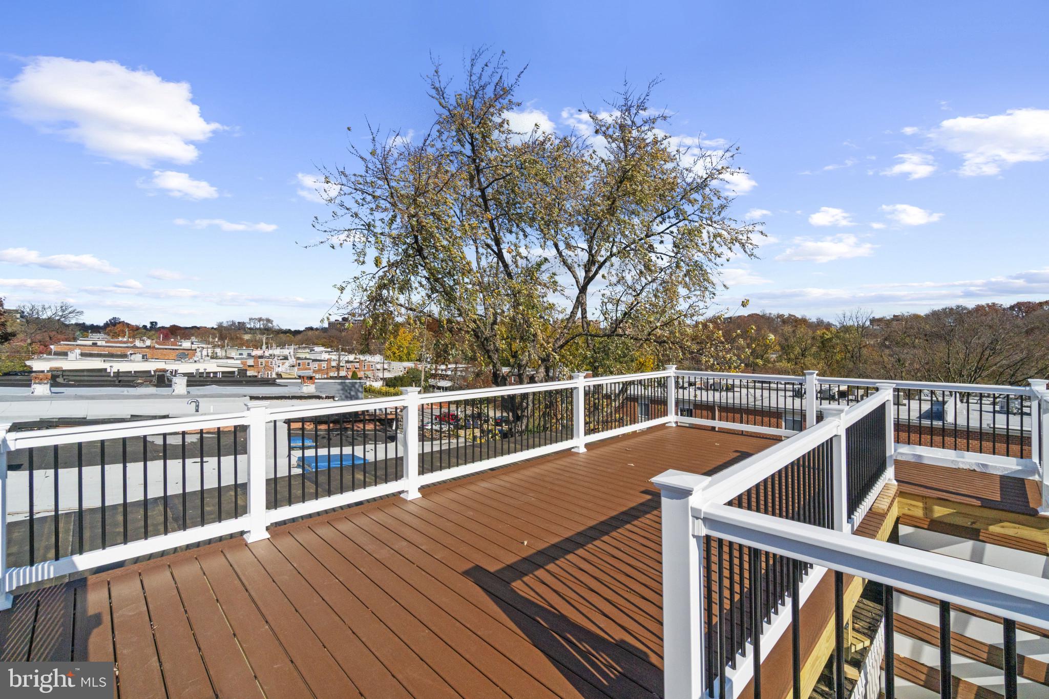 3461 Keswick Road Baltimore, MD 21211 - Photo 12 of 33 a view of balcony with wooden floor and fence