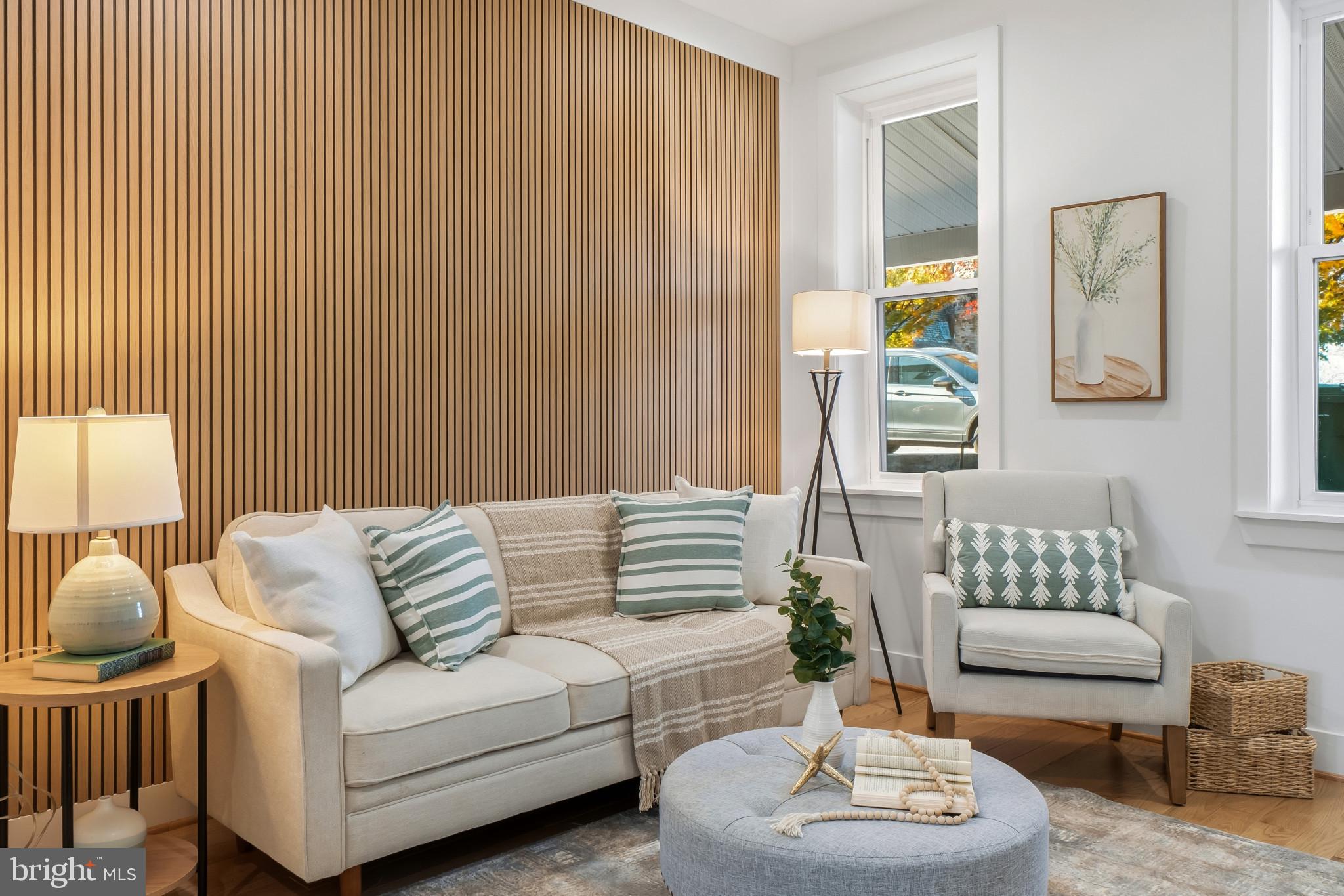 3461 Keswick Road Baltimore, MD 21211 - Photo 2 of 33 a living room with furniture and a potted plant