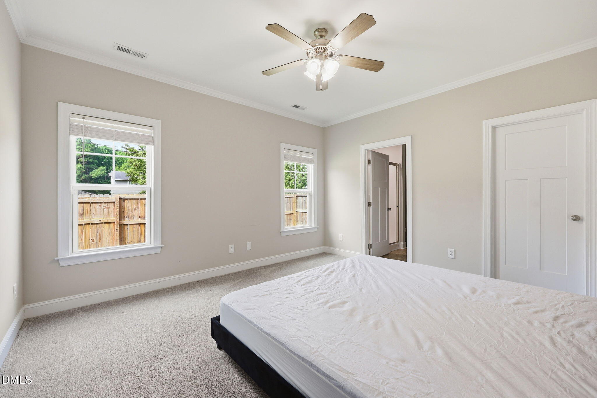 709 South Pollock Street Selma, NC 27576 - Photo 19 of 30 a bedroom with a large bed and a window
