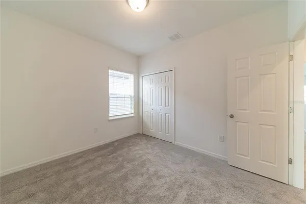 a white toilet sitting next to a bath tub
