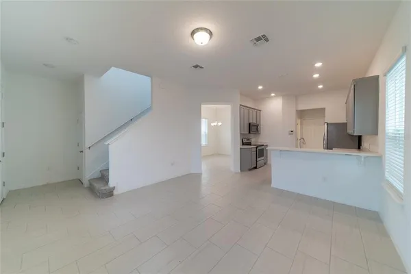 a view of a hallway with kitchen and kitchen view
