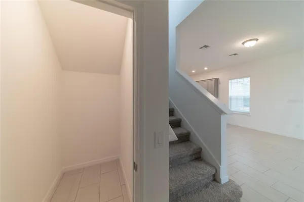 a view of a hallway with staircase