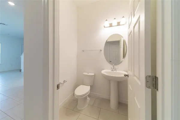 a bathroom with a toilet and a sink