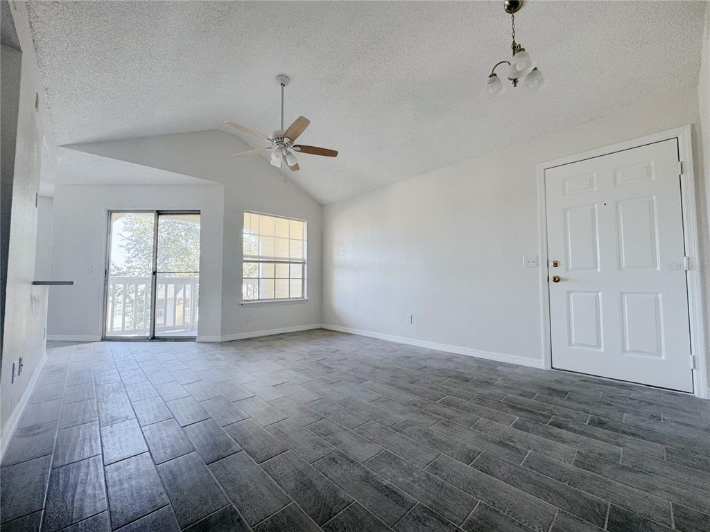 1013 South Hiawassee Road, Unit 3635 Orlando, FL 32835 - Photo 4 of 20 a view of an empty room with a window