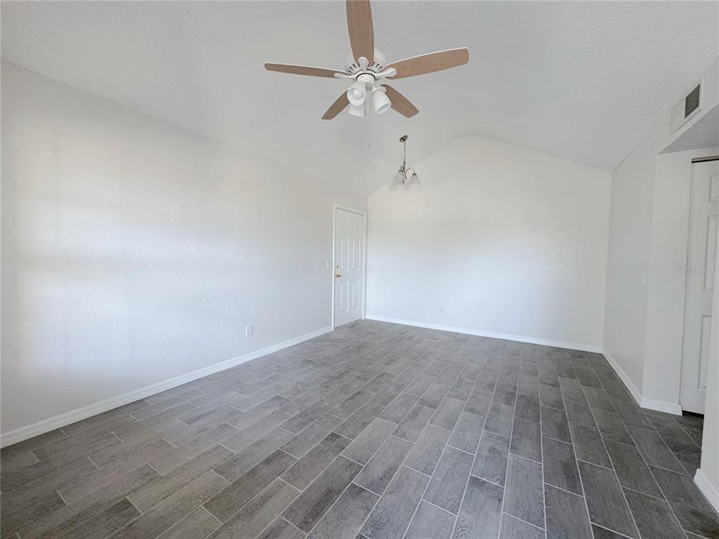 1013 South Hiawassee Road, Unit 3635 Orlando, FL 32835 - Photo 6 of 20 wooden floor in an empty room