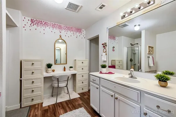 a spacious bathroom with a double vanity sink mirror and
