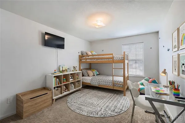 a room with a bed and a window