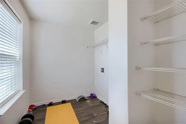 a view of a workspace with furniture and a bedroom